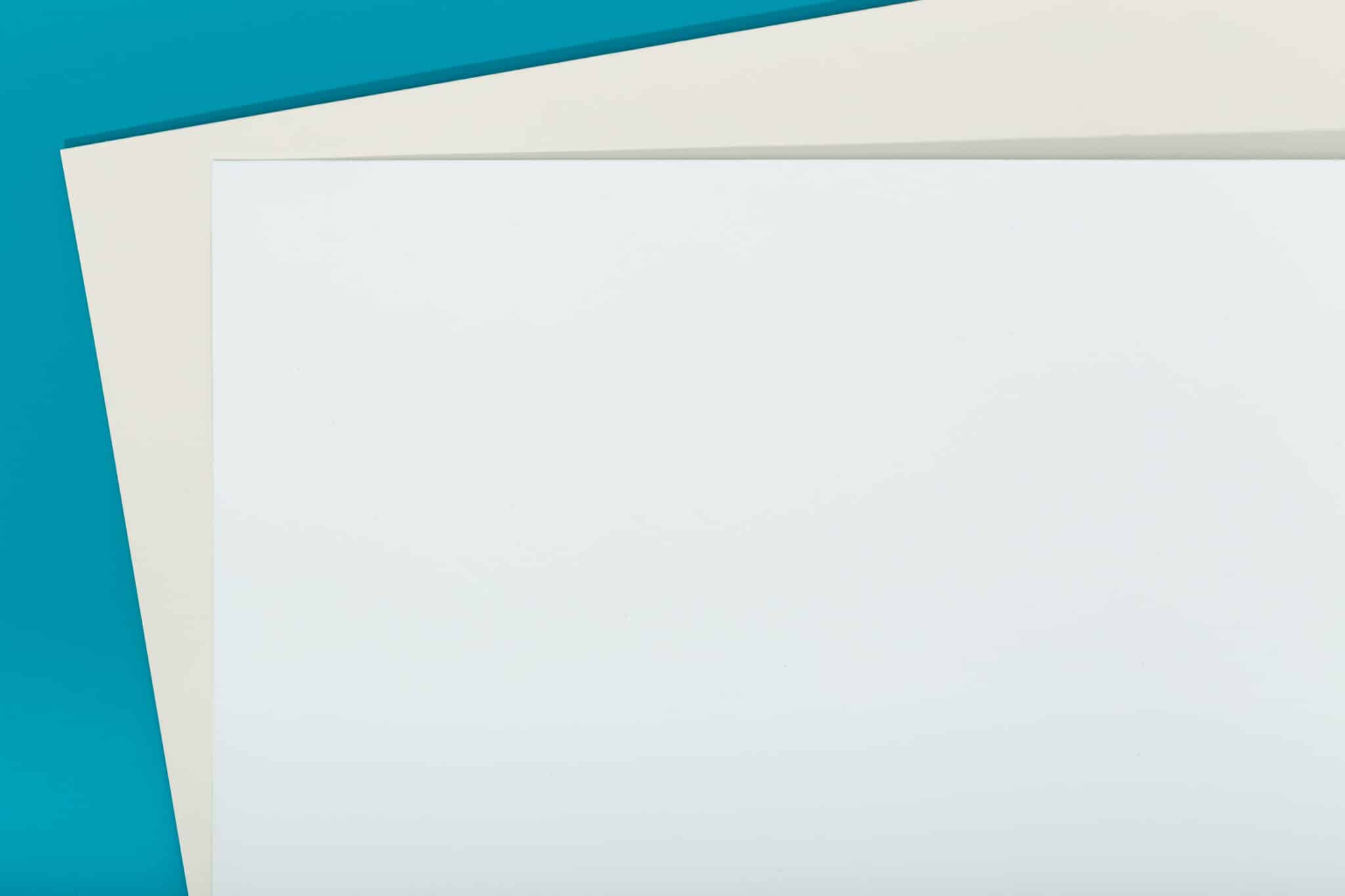 Abstract blue, beige and white color paper geometry composition background. Group of three color cardboard. Copy space Right Paper Weight
