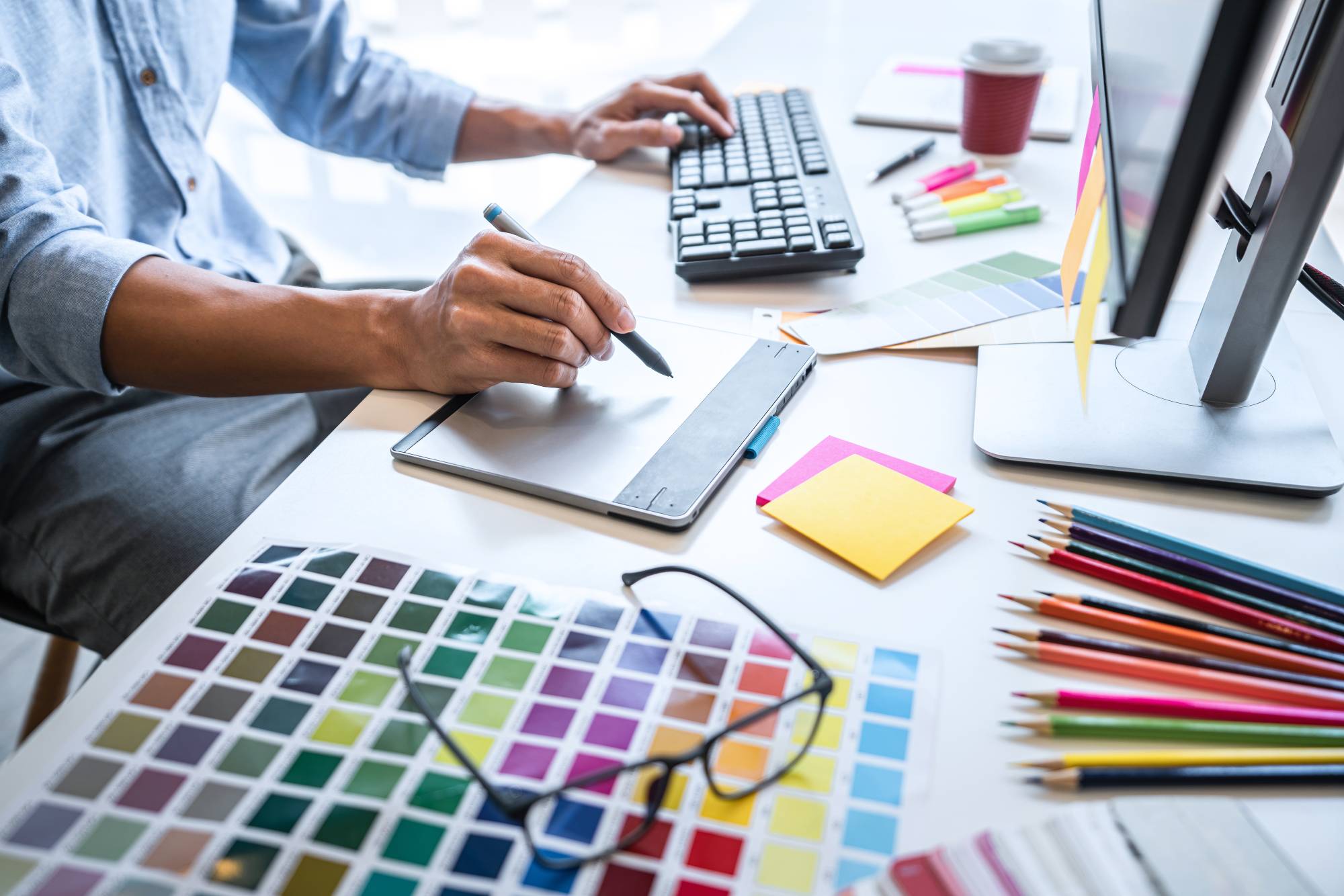 designer-working-at-desk-with-color-swatches-2026-03-17-21-37-39-utc (1) Graphic Design